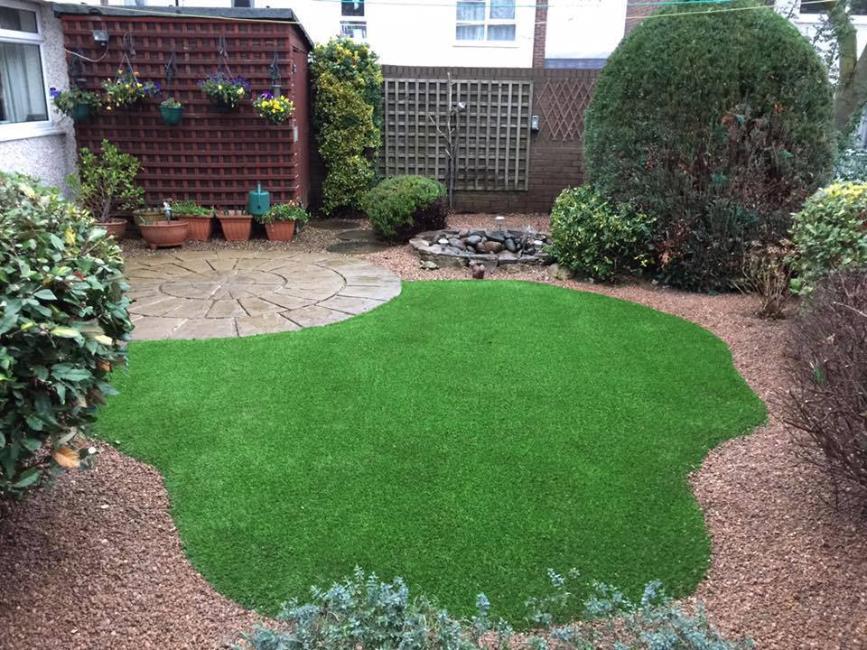 shaped synthetic lawn installation