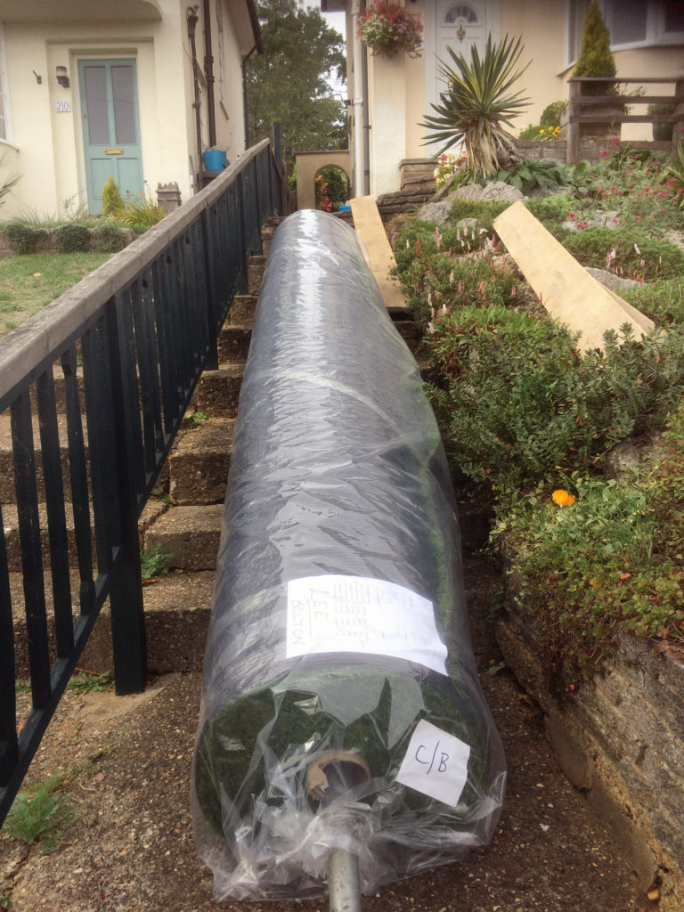 Taking 160m2 of artificial lawn up a small garden path